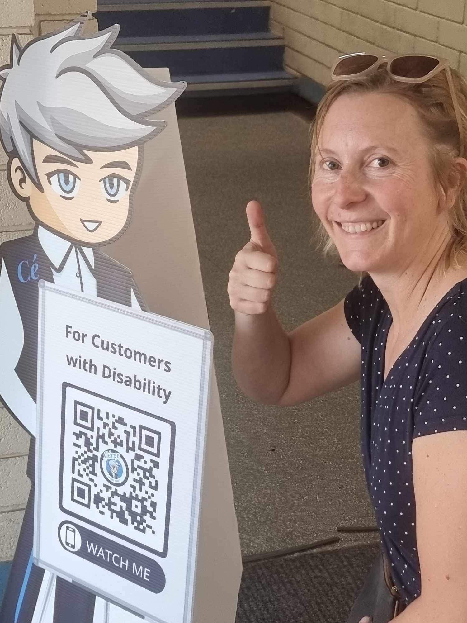 A woman with a dog and a Cérge cardboard cutout outside a recreation centre. A woman with a dog and a Cérge cardboard cutout outside a recreation centre.